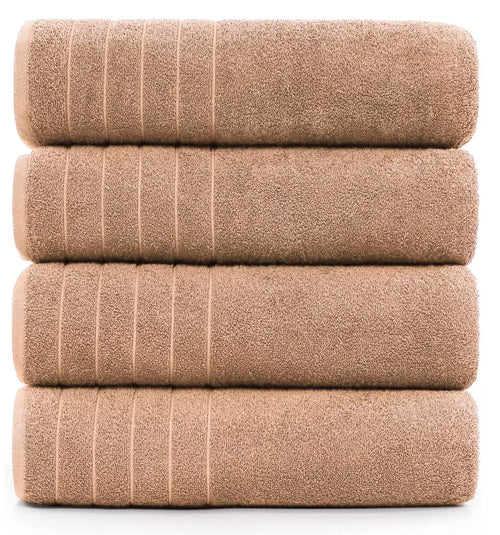 Spa-like experience with a white 600-GSM bath sheet and candles